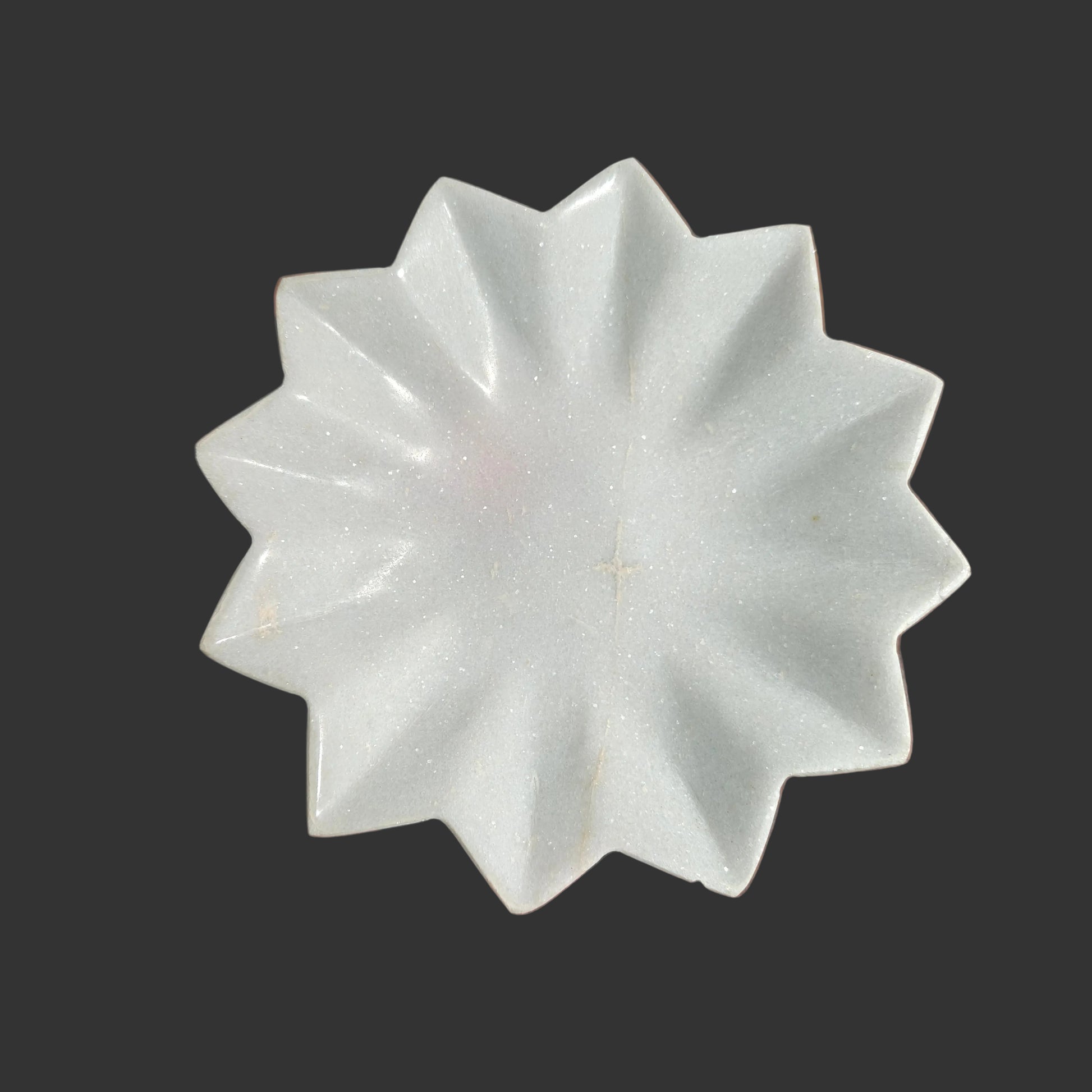 White marble star plate top view geometric pointed design Rajasthan